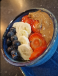 orridge layered with banana, strawberries, blueberries & peanut butter